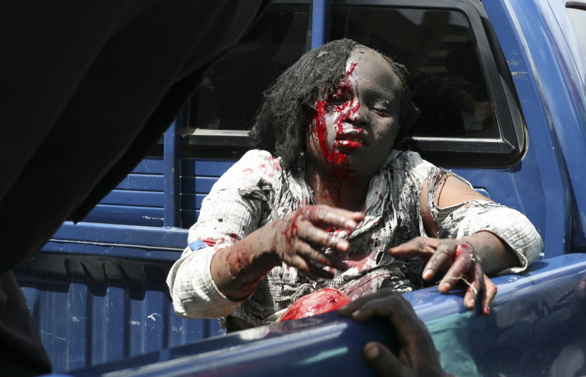 2012��3��28�գ��������׶����ޱϣ�һ�����˵ĸ�Ů���ھ�����Ƥ���REUTERS/Johnson Mugo
